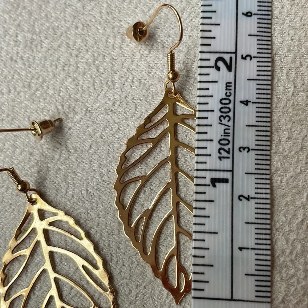 Gold hollow leaf earrings
